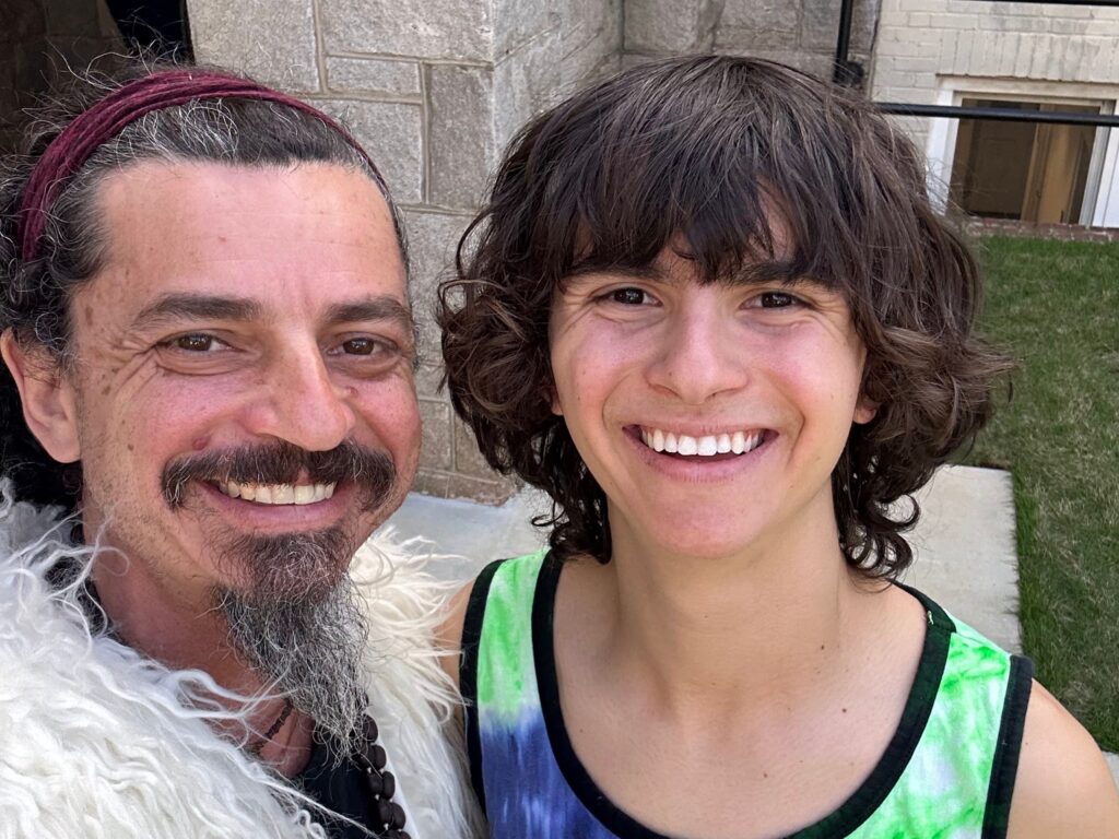 father and son smiling together